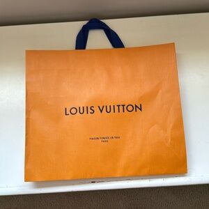 Louis Vuitton shopping bag. Approximately 15 inches by 13 inches